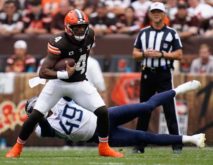 Cleveland Browns quarterback Deshaun Watson (4) gets away from Tennessee Titans linebacker Arden Key (49) during the first quarter in Cleveland, Ohio, Sunday, Sept. 24, 2023.